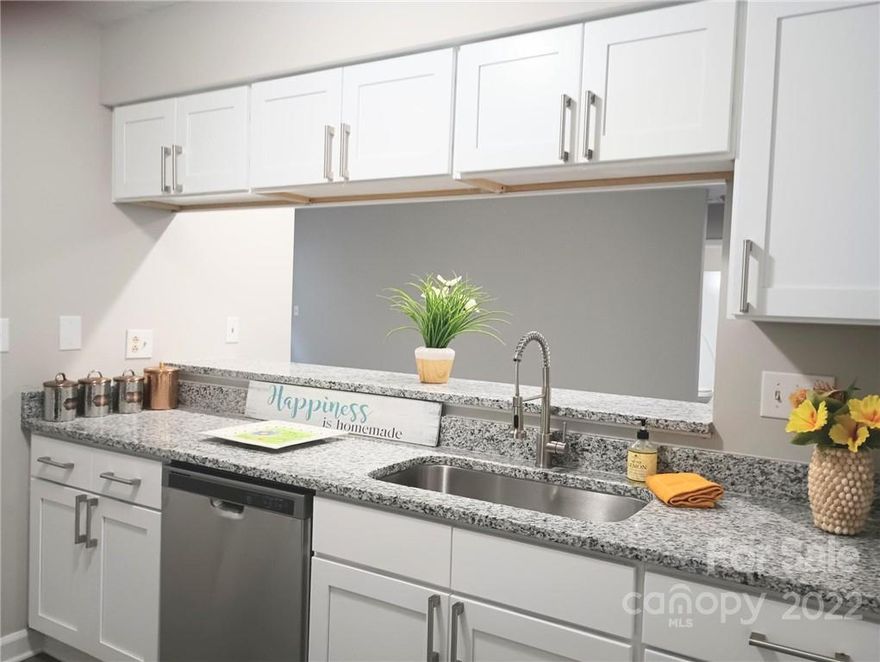 Extensive Rehab Includes NEW: Kitchen With White Shaker Kitchen Cabinets, SS Appliances, 9" Undermount Sink, Granite Countertops with overhang bar stool sitting area, Cabinet Pulls, Luxury Vinyl Plank Flooring, Carpet & Pad, Vanities, Toilets, Faucets, Mirrors, Lighting, Door Knobs, Hinges, Hardware, Supply Lines, etc. Also: New HVAC $5,500.00. New Siding where needed. Fresh Paint Inside. Too Much to List.  Reasonable HOA Dues of $127/mo. Move In Ready..!! Main Level. No Steps to Climb. Pet Friendly. There is a dog washing station on the deck..!!. The only negative feedback is that buyers did not like the rear deck. Seller will escrow $2,000 to paint/update it. Not much " NEW " Inventory, so come take a Look..!!