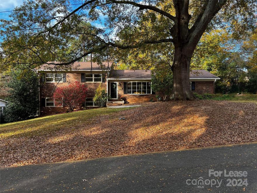 Welcome to this beautiful 4-bedroom split-level home in a serene Dallas neighborhood! As you enter, the charming foyer leads to an inviting family room filled with natural light. The adjacent eat-in kitchen features beautiful granite countertops and modern appliances, perfect for dining. Upstairs, you'll find three generously sized bedrooms and a well-appointed primary bathroom. The lower level offers a second family room with built-in shelving, a fourth bedroom with an adjacent bathroom, and a laundry area with ample storage. This move-in-ready home combines modern comforts with stylish design, offering endless possibilities. It is located within a stones throw of downtown Dallas, shopping, parks, and dining and provides the perfect blend of suburban tranquility and city convenience. Don't miss out on this exceptional Dallas home!