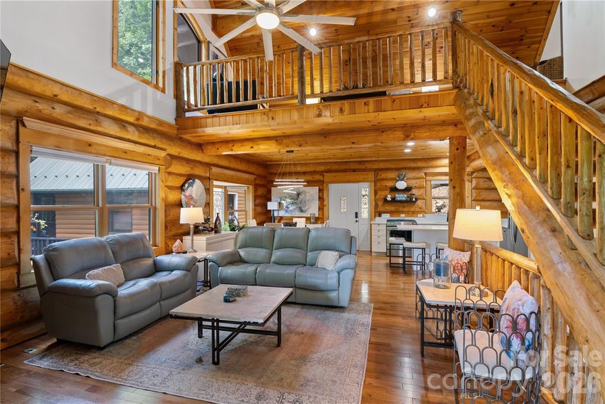 Experience the ultimate mountain lifestyle in beautifully updated Log Cabin nestled in Wolf Laurel. 3 bds—possible 4th, 3.5 ba, loft, lg 2-car garage, home combines timeless mountain charm w/modern conveniences. Meticulously maintained & updated throughout: HVAC, full-house generator, instant-on hot water, renovated kitchen & baths, + convenience of 2 sets of washers/dryers. Surrounded by Blue Ridge Mountains, accessed by well-lit paved roads, property offers comfort & accessibility year-round. Wolf Laurel offers incredible mountain amenities & active lifestyle: skiing, mountain biking, golf, tennis, pickleball, swimming, hiking along Appalachian Trail, dinning, & vibrant social calendar. Some amenities require club membership. Conveniently located near both Asheville, NC & Johnson City, TN-exceptional mountain retreat is ideal as a full-time residence, vacation home, or investment property. Come enjoy cool mountain air, breathtaking scenery, & everything mountain living has to offer.
