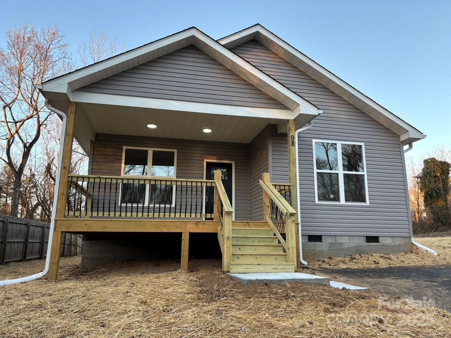 Best price per square foot for new construction in this area and less than 10 minutes to all things Asheville! This one flows nicely with an open concept living/dining/kitchen area, sensible split bedroom plan, high end finishes, and a bright, open feeling. This floor plan is great for entertaining! Luxury Vinyl floors in the common areas, beautiful quartz counters/bar in kitchen, and relaxing breakfast/dining area. 9 foot ceilings throughout the entire house, large windows, and custom lighting are among the highlights. Primary bedroom suite is quiet and on the back side of the house with a large walk-in closet. The primary ensuite bath features a large walk-in shower, dual sinks, and cultured marble counters. Want to explore? Start out with morning coffee on the front porch or fire up the grill on the 5' X 8' side deck. This is one of Asheville's most popular neighborhoods located less than 10 minutes from downtown Asheville, less than 5 minutes to Biltmore Village/Biltmore Estate, and also close to Mission Hospital, shopping, restaurants, and everything that you love about Asheville. Come see why this one is different! You'll love this floor plan, the attention to detail, and the neighborhood!