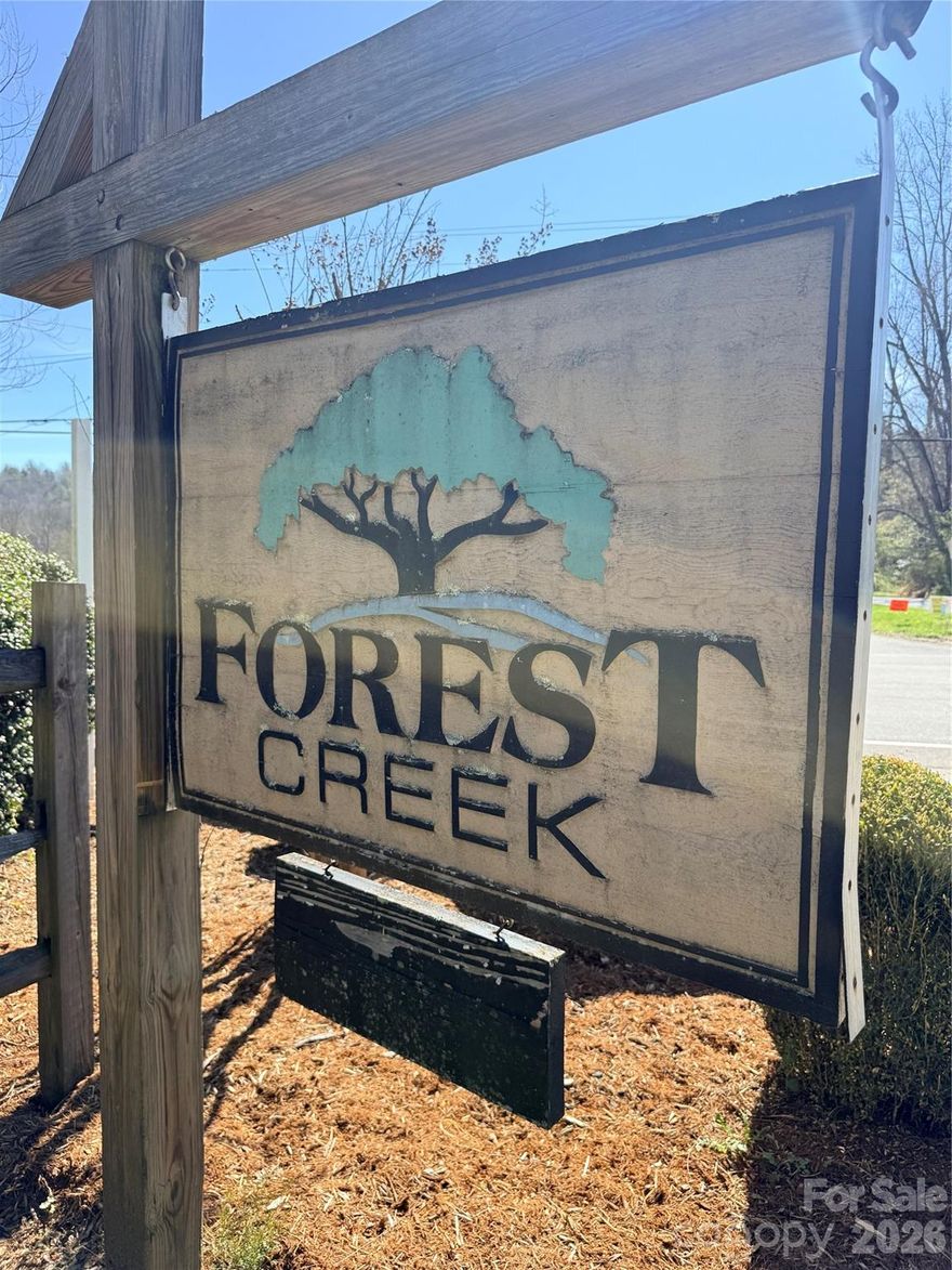 This 1.7-acre lot is tucked away in the private, gated Forest Creek neighborhood, offering the perfect spot to build your dream home. Single-level homes require a minimum of 1,100 sq. ft., while multi-level homes need at least 1,400 sq. ft. Outdoor enthusiasts will love being close to the Wilson Creek and the Pisgah National Forest, ideal for fishing, kayaking, hiking, and camping. Just a short drive from Lenoir, Blowing Rock, and Boone, this property combines peaceful seclusion with convenient access to nearby towns.