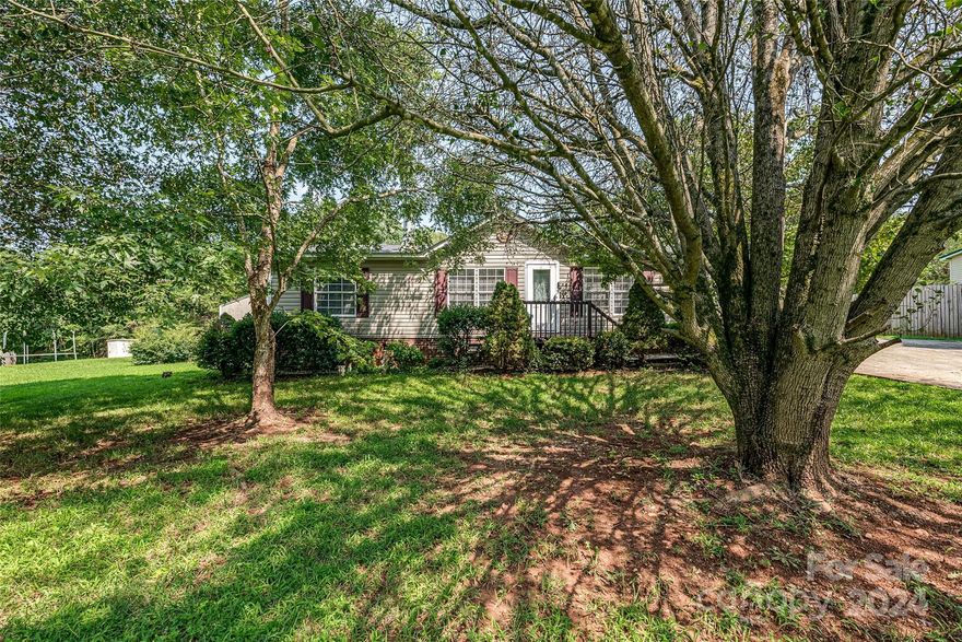 Country Living in Rockwell, no HOA, peaceful and quiet. This Ranch home is 3 bedrooms, 2 baths and over 1200 square feet. All electric, Fireplace with Wood Burning insert, cozy for the cooler weather. Vinyl plank flooring Brand New HVAC unit installed in May 2024. Front Porch entry, Side door entry from car cover make access convenient with groceries. Kitchen Island with sink and storage, Electric Stove, Microwave, Refrigerator, Washer & Dryer and window treatmewnts will remain. Concrete Driveway and Double carport keep vehicles cooler & safe. 3 Out buildings remain at the property. 8X10,10X20, 12X10, They are not pretty but very useful Property has mature landscaping in the back, nice flat yard to have fun! Lovingly maintained, this home also comes with a 1 year American Homesheild Warranty in place. ***** PLEASE PRESENT ALL OFFERS BY 8PM Friday 8/2/24*****