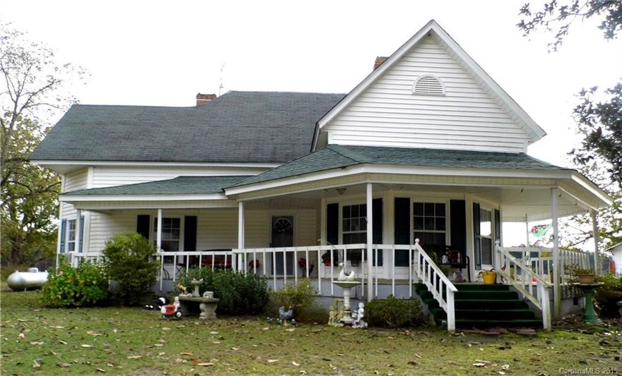 REDUCED!!!  This house is full of southern charm with the wrap around front porch, established trees and rural location.  It features spacious rooms with high ceilings, country kitchen, wood floors and lots of room to roam.  Make "this old house" your dream home with some renovations/updates.  Don't miss this one!