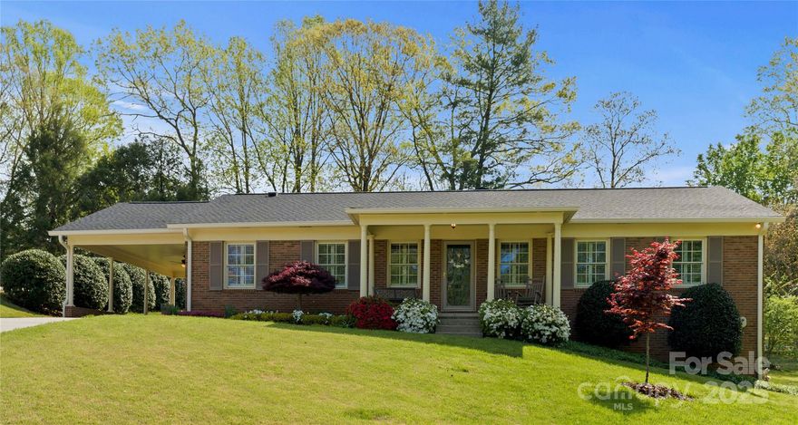 Charming brick ranch w/ pool on a spacious, landscaped lot in an established neighborhood! New roof/gutters 2024. Welcoming front porch, beautiful curb appeal, & covered carport. Inside, enjoy abundant natural light, hardwood floors, and a flexible floor plan with 3 bedrooms & 2 full baths. Kitchen features custom cabinetry, granite counters, and stainless appliances. Large dining area with built-ins and gas logs (2023) overlooks the backyard—perfect for entertaining, gardening, or play. Living area boasts large windows, plantation shutters, & crown molding. Generous primary suite designed for comfort & privacy with large sitting area or home office set up. Basement features coffered ceiling w/ gas logs (2023) & full bath, plus large laundry/flex space—ideal for a man cave, playroom, teenagers, or office. Immaculately maintained & MOVE IN READY!