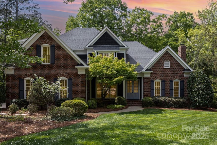 Stunning brick home in sought after Highgate community. Downstairs the 10' ceilings and wall of windows allow for maximum natural light. Grab your morning coffee and listen to the birds sing while relaxing on your screened in porch in your private back yard. Large primary bedroom downstairs with updated bathroom complete with two separate vanities, tray ceiling, updated tile, and huge walk in shower.  Kitchen boasts stainless steel appliances, double wall oven, 2 dishwashers, gas cooktop, pot filler, and white cabinets with gold hardware.Updated lighting throughout the home and such attention to detail with crown molding, and wainscoting. Custom bookcases surround the gas log fireplace in your family room. Another wood burning fireplace in the front room will keep you cozy in the winter months. Entire home is freshly painted and new carpet upstairs. 3 more bedrooms upstairs each with their ensuite full bathroom.All bedroom closets have been updated with California closets.Welcome home!