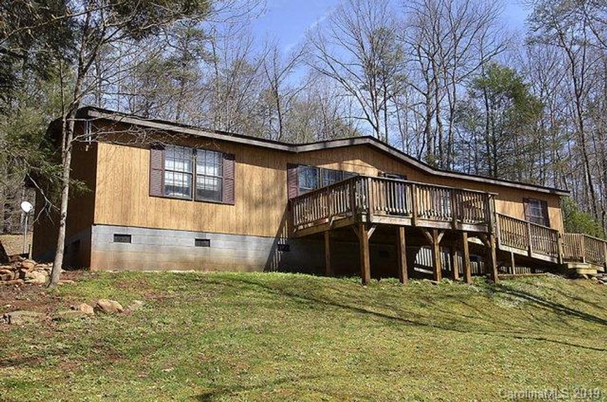 Move in ready! Nice Horton Brand home in Pleasant Gardens area with plenty of room for everyone...includes both a Living Room with laminate flooring, picture window & vaulted ceiling and Den/Home Office; Master suite features oversized tub/shower and walk in closet; With a split bedroom floor plan there are 3 additional bedrooms...one w/new carpet. Kitchen includes appliances, stainless sink and plenty of cabinets! Laundry features a Kenmore washer & Kenmore dryer & additional cabinets for storage. Other features include: new front porch deck and ramp built in 2010; concrete block permanent foundation; 2 outside storage buildings...one almost new w/good shelving for storage; architectural shingle roof is app 1-2 yrs old; laminate flooring installed in 2009; well is 245' deep; very nicely landscaped w/creek and private backyard!