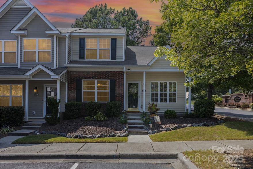 Beautifully updated end-unit townhome with a spacious first-floor primary suite. The main level features durable LVP flooring in the living areas, dining room, and kitchen, with cozy carpet in the primary bedroom. The light-filled living space flows seamlessly to a private enclosed patio/courtyard, perfect for relaxing or entertaining. Upstairs, you’ll find a generous bedroom with a full bath, plus a second bedroom with walk-in closet and window—currently designed with a loft-style opening to the lower level, but easily enclosed to create a third private bedroom if desired. Major updates include a new HVAC system in 2025. With its versatile floor plan and prime location close to shopping, dining, and commuter routes, this home is a rare find! Agent is related to the seller.