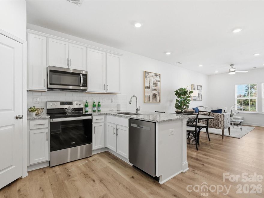 New Construction with $0 down and a 2.5% FIXED interest rate. Program details are in the attachments. Sycamore Trail townhome community, 2 miles from historic downtown Matthews. 2 ensuite bedrooms with a bonus flex space on the lower level. Single-car garage with MyQ app opener. Designer-inspired 42" kitchen cabinets, granite countertops, stainless steel appliance package, recessed LED lighting, LVP flooring, and more. The 62-unit community is super convenient and walkable for shopping, dining, entertainment, and schools. Easy access to 485 and 74. Amenities include walking trails, a dog park, a playground, green spaces, and hammock stations. All Landscaping, water, and sewer are included in HOA dues.  
PHOTOS -  2 Units available. The gray Kitchen is Unit 3132 and is a left orientation.  The white kitchen is Unit 3136 and is a right orientation. The furnished photos are of the builder's model and are for representation purposes only.