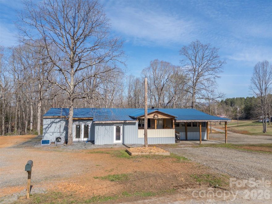 Tons of potential with this 5+ acre parcel in tranquil rural setting in Lawndale.  Property features a 3 bedroom 2 bath manufactured home w/wood-burning fireplace, spacious eat-in kitchen w/island, mudroom/laundry and huge covered front porch.  Several large rooms have been added onto the home, including a walk-in cold storage.  Areas are fully insulated, wired & climate-controlled with mini-splits and just need the finishing touches.  Stocked spring-fed pond w/covered pier for hours of fishing enjoyment or just observing the wildlife.  Several areas of cleared pasture and clear-cut trail down to the back of the lot.