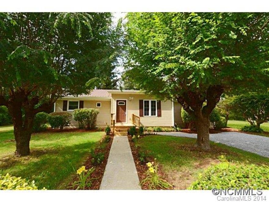Totally UPDATED! Entire house has been updated.  Beautiful cabinets, granite tops, SS appliances, hardwood floors, sunroom, ceiling fans, fireplace.  This is like a brand new home.  New HVAC, metal roof, kitchen, baths, carpet, lighting, and much more.  GREAT bargain at this price for this large home!  Combine with adjacent lot for $170,000.  Combine with adjacent lot and lot across the street for $180,000.