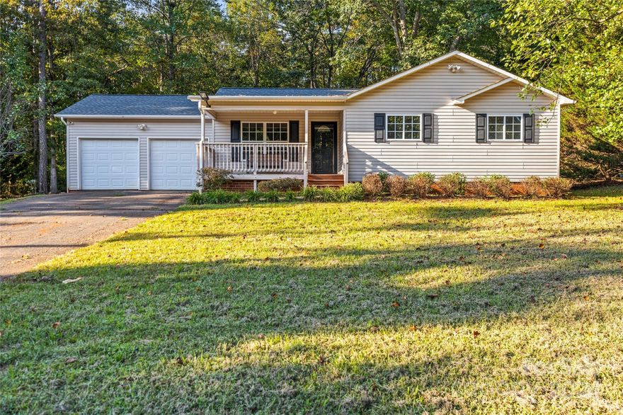 Welcome to this charming, one-owner ranch-style home, nestled on an exceptionally private .42-acre lot with no HOA & a double-car garage. Inside, you’ll find a freshly painted interior that highlights the gleaming hardwood floors. The kitchen has been upgraded with brand-new countertops, sink, faucet, hardware, and sprayer. The massive, enclosed deck is perfect for entertaining, offering a versatile extension of the home’s living area, ideal for hosting memorable gatherings or creating a functional space tailored to your needs. The primary bedroom has a large walk-in closet and ensuite bath, providing the ultimate convenience. Secondary bedrooms are generously sized, perfect for family or guests. Recent updates include a new septic system (2023), heat pump (2021), and roof (2018), ensuring peace of mind. Plus, you’re conveniently located less than a mile from the elementary school and under five miles from the mid and high schools. With I-40 just four miles away, commuting is a breeze.