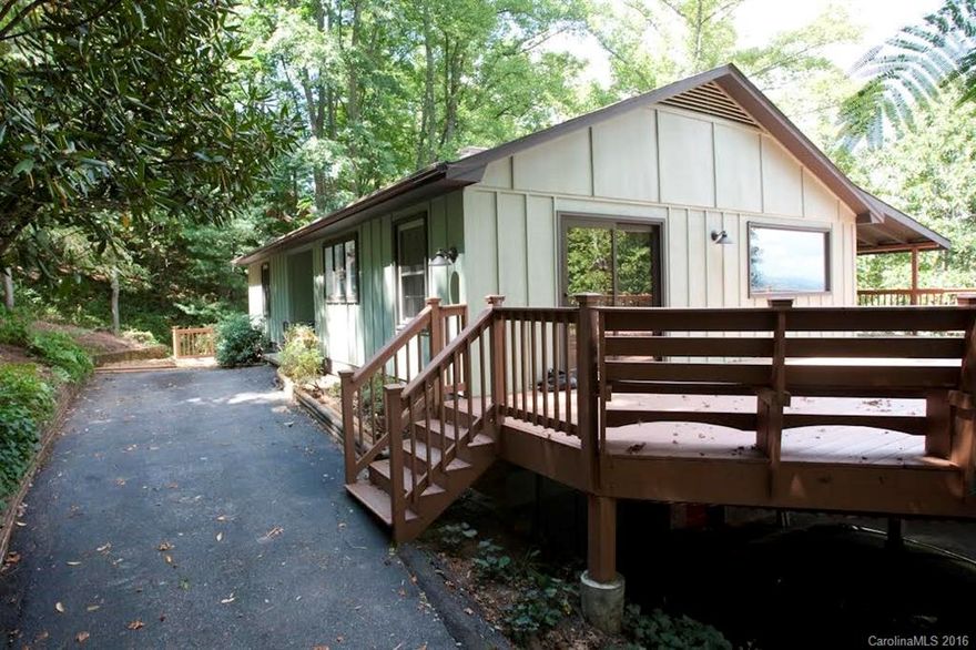 Completely renovated cabin/ranch in the mountains with views and only minutes to Asheville, Weaverville, and many conveniences! HW floors throughout main level. Granite tops and SS appliances in kitchen. Updated baths throughout. Cozy floorplan. Approx. 600 SF of covered and open decking for sun, relaxing, and entertainment. Completely painted inside and out, top to bottom. Wooded lot with privacy and level areas for play, horseshoes, and fire pit socials. This is mountain living at it's finest!