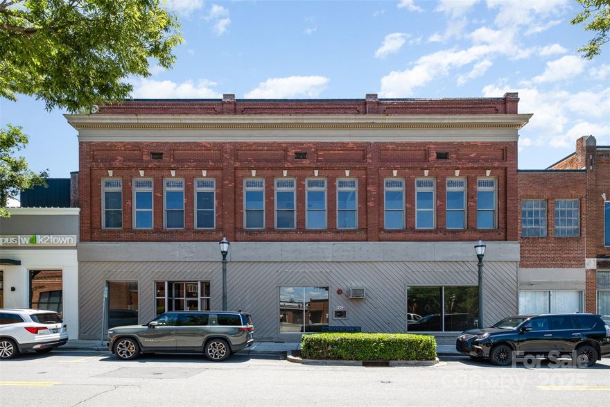 This stunning historic building in the heart of downtown Rock Hill offers a rare opportunity to own a piece of local history with exceptional investment potential. Built in 1920 and located within a designated Opportunity Zone, this property provides significant tax benefits along with eligibility for historic building renovation incentives. This is a mix use property giving the investor a lot of desirable uses options with great income potential. High end condos overlooking downtown area could be created at the top floor while utilizing the first floor for retail, restaurant or office purposes. This central location will support all of those uses and the city's rapid growth and development will ensure its success.