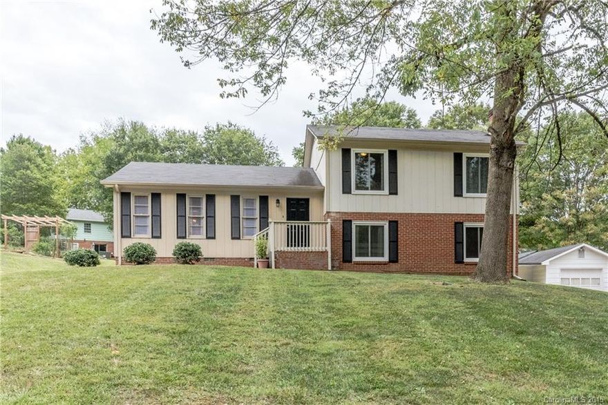 Beautiful home in sought after neighborhood! JUST Freshly painted inside a neutral color, UPDATED EAT-IN KIT w/granite,ceramic tile floors, 42" cherry cabinets, stainless appliances! DR, LR, 5 very large Bedrooms or use 1 as a Bonus Room, 2 Master Suites, new Blinds, ceiling fans, newer neutral carpet, updated light fixtures, Down Master Bedroom has new oversized shower!  3/4 of homes windows have been replaced! 3 FULL BATHROOMS plus HALF Bath! This home is move-in ready on large lot!