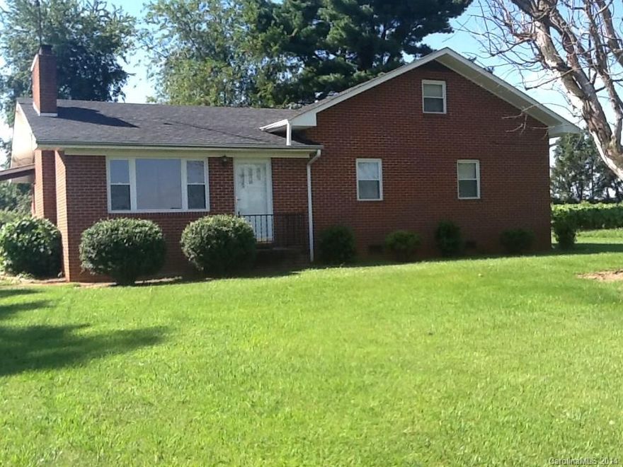 All Brick Home with 36+-Acres close to town, but convenient to Interstate 77. Approximately 1800 feet of road frontage. Small Pond and Crop Land with excellent topography. A 30'x30' Barn with a 10' drive thru center is also on this property.  New Insulated windows, Roof replaced approximately 8 yrs ago.  The dwelling was built in 2 different periods with the original dwelling having 7'3" ceilings and the newer section having 8' ceilings.  The attic is a walk up & is finished with HVAC ducts.