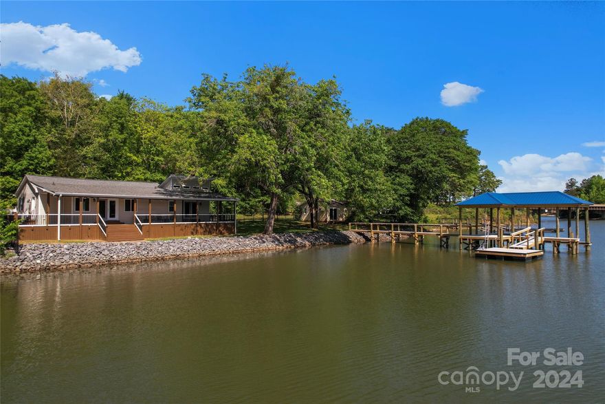 Double lot-2 for 1 Waterfront! - 1270= Single Family home with 2 bedrooms & 2 full baths (1500 Sq Ft)  & 1276=  Studio with 500 Sq Ft + full bath - Grandfathered in 50 Ft waterfront set back makes this property so special - Live in Main House and Build your dream home next door - Brand new 1000 Sq Ft Covered Boat dock, pier, and floating swim platform (11/23) -  New Shoreline restoration 2019 - Main residence roof 2020 - Amazing water views from both homes -  Updated electrical, lighting, plumbing, insulation, vinyl exterior, windows, sliding doors -  Huge covered back porch with panoramic water views, runs the length of the main home - Approximately 220 ft of shoreline - Relax outdoor under your covered porch with ceiling fans and mounted TV for year long enjoyment - 1276  Pole Branch is a Studio Cabin with 500 Sq Ft and is grandfathered next to the water - Remodel/ Rebuild .. the possibilities are endless -  parking for your RV, Semi or Boat (with electric hookups) - Call anytime!