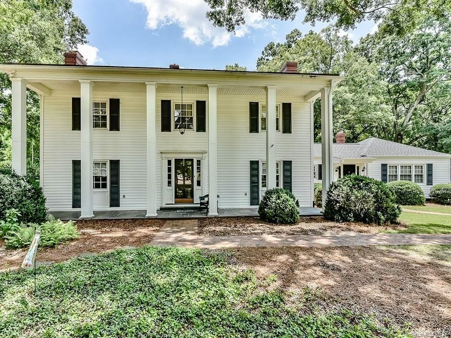 Charming center hall Colonial on fabulous 2.65 acre lot on one of Charlotte's best streets. This home has been lovingly maintained by its 2nd owners for over 40 years. Updates have been made to the kitchen and baths. Downstairs bonus room could be made a downstairs bedroom but presently used as bonus. Perfect opportunity for country setting living in the city.