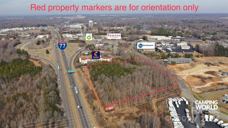 5.93 acres, I-77N to Exit 49-A, Right onto US-70, Right onto Morland Dr, Lot is on the right, just past the Hotel before Camping World, Great location, 478 ft along I 77 N, 460 ft on Morland Road, Lots of potential, zoned B-5 General Business.