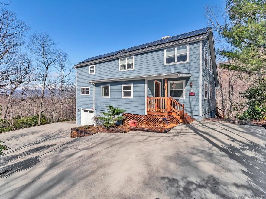 Open and Bright, Big windows with views, and Move in Ready! This 5 bedroom, 4 bath home offers space for entertaining, large kitchen with luxury SS appliances open to great room and Sun porch. Dining area with fire place. Oversize master w/ his & her walk in closets, Solar system, Generator, additional buildable lot,  convenient location.