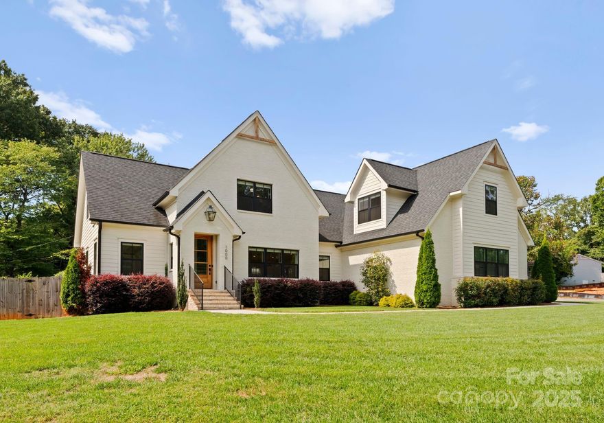 Discover 1000 Sewickley, a striking 5-bedroom, 4.5-bath custom-built residence completed in 2021 and perfectly positioned on a rare .34-acre corner lot in the sought-after Ashbrook-Clawson neighborhood of Charlotte. Designed with both luxury and livability in mind, this home presents an expansive open floor plan enhanced by wide-plank hardwoods, high ceilings, and abundant natural light. At the heart of the main level is a chef-inspired kitchen boasting a massive quartz island, stainless steel appliances, custom cabinetry, and a walk-through butler’s pantry ideal for storage and prep. The kitchen flows seamlessly into the dining area and family room, creating a warm, inviting atmosphere that extends to a covered outdoor patio built for entertaining year-round. The first-floor owner’s suite is a true retreat with oversized windows, a spa-style bathroom featuring dual vanities and an oversized walk-in shower, plus a custom walk-in closet that offers both style and function. A thoughtfully designed first-floor laundry room with built-ins and a sink makes daily routines simple and efficient. Upstairs, you’ll find a spacious loft perfect for a playroom, media area, or flex space, along with generously sized secondary bedrooms, including another ensuite bedroom and bath. Unique to this property is the fully equipped in-law suite located above the attached two-car garage, complete with its own full kitchen, private living space, ensuite bedroom and bath, and most notably, a private exterior entrance and egress for ultimate independence and privacy—perfect for multi-generational living, guests, or even rental income potential. The fenced backyard offers green space for outdoor activities, pets, or gardening, all while maintaining a sense of privacy on its corner lot setting. Every detail of this home has been carefully curated to balance everyday convenience with upscale finishes, from the oversized quartz counters to the elegant hardwoods throughout. Its location is second to none—nestled in one of Charlotte’s most desirable neighborhoods and just minutes to SouthPark, LoSo, and South End, providing easy access to breweries, dining, shopping, and entertainment, as well as proximity to top schools and major commuter routes. Rarely does a property combine modern construction, thoughtful design, and such a prime location in one package, making 1000 Sewickley a truly exceptional opportunity in today’s Charlotte market.