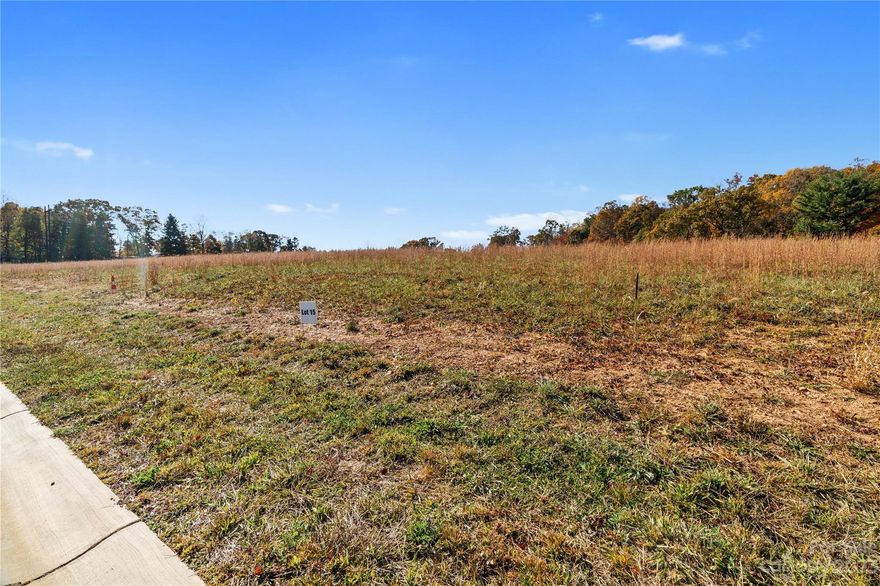 Easy to build on lot in a beautiful BRAND NEW 33 lot development with a nicely paved street that ends in a charming cul-de-sac, so you get no thru traffic. Power and Woodfin water are already in the community and this particular lot has perked for a 3-bedroom septic-making your building process drastically simplified with much of the leg work already complete! Super location with the grocery store and several dining options nearby and you get to enjoy enchanting views of the French Broad River as you make the short drive to vibrant downtown Asheville that offers the best cultural, artsy & culinary scene this area has to offer. With such an attractive opportunity, this is the spot you've been waiting for to build your DREAM HOME! Several lot options to choose from, come see them today! No restrictions against STR's.