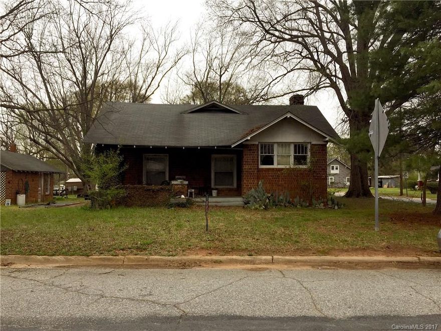 Hello Investors!!  Great Potential in this Adorable Bungalow! 3 Bed/1 Bath. Large Corner Lot. Rocking Chair Front Porch. Original Hardwoods Floors. Original Solid Wood Doors and Hardware.  Garage/Outbuilding. Needs some TLC.
