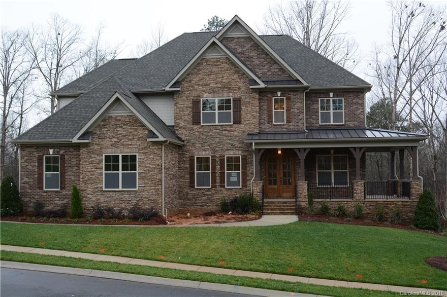 Stunning all brick home in prestigious Tega Cay! Dual Master with chefs gourmet kitchen with high end appliances, 5" hardwoods first floor, 3 car side load garage, ceramic tile in all baths, 3 piece crown mouldings and private lot. This home is a must see with so much to offer minutes from shopping, restaurants, I-77 and only 25 minutes from uptown Charlotte.