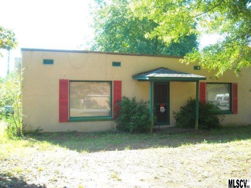 Great investment opportunity. Built as a duplex, but owner uses whole house. Two baths, 2 kitchens, 2 bedrooms, living rooms. Per owner, some leaks in flat roof. Could be converted to single family.