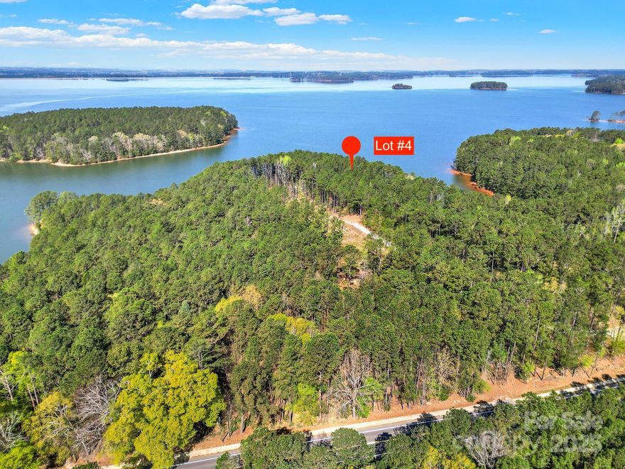 Make these big water views of Lake Monticello yours! This 1.9 acre wooded lot is nestled in the calm & quiet Jenkinsville, SC, just 30 minutes from bustling Columbia, SC and 1.5 hours from the Charlotte Metro area. Per Dominion Energy, this waterfront lot has 289 feet of shoreline which gives it ample possibilities for a prime dock location (dock permit will need to be applied for and approved by Dominion Energy). Cardinal Pointe also has an entry gate that adds privacy and security. Come see if this epic waterfront view could be the future location of your dream build or recreational getaway cabin!