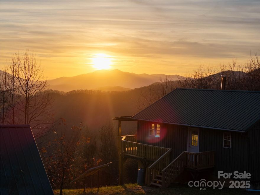 Discover the perfect blend of convenience, privacy, and mountain serenity at 506 Rocky Acres—a true Western North Carolina retreat set on approximately 14 acres and located just minutes from I-40, downtown Canton, Asheville, Waynesville, and Maggie Valley. Whether you're seeking a full-time residence, a weekend escape, or a unique short-term rental opportunity, this property offers an exceptional setting with features rarely found at this price point.
Perched on a peaceful ridge line, this expansive property showcases breathtaking long-range views of iconic Cold Mountain and multiple surrounding ranges. Enjoy unforgettable sunsets and quiet mornings on the back porch as the landscape shifts with the seasons—verdant greens in summer, kaleidoscopes of color in fall, and snow-kissed peaks in winter.
At the heart of the acreage sits a charming off-grid cabin, thoughtfully equipped with solar power and a spring-fed water source, allowing for self-sufficient, low-impact living without sacrificing comfort. The cabin features a cozy interior layout, natural wood finishes, and windows that frame the spectacular views. Whether used as a personal getaway, guest house, or creative space, it provides a rare opportunity to unplug and unwind surrounded by nature.
The 14 acres offer a mix of gentle and sloping terrain with opportunities for gardening, hiking, recreation, or future expansion. Mature hardwoods, abundant wildlife, and quiet surroundings create a sense of true mountain escape while remaining close to all modern conveniences.
With easy access to outdoor recreation, hiking trails, the Blue Ridge Parkway, and the vibrant culture and dining of Asheville, this property delivers the ideal balance of solitude and accessibility. Properties combining this level of acreage, views, and off-grid capability do not come along often.
If you’ve been searching for a mountain property with character, potential, and unforgettable vistas—506 Rocky Acres is a must-see. Schedule your showing today and experience the magic of Cold Mountain from your own private perch.