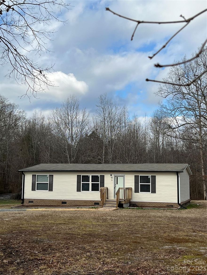 Adorable 2015 manufactured home just minutes from vibrant downtown Lincolnton for under $180,000!  This home comes with over an acre of land, 3 bedrooms and 2 full baths and nearly 1200 square feet of living space.  It has a split floor plan and each of the three bedrooms has walk-in closets.   New interior paint and new flooring throughout the home.  Open floor plan for easy entertaining, kitchen appliances convey including refrigerator, and fenced backyard. The property line goes well beyond the fenced area in the back. Nice country setting but close proximity to amenities like dining, shopping and medical facilities.   Schedule your showing now!