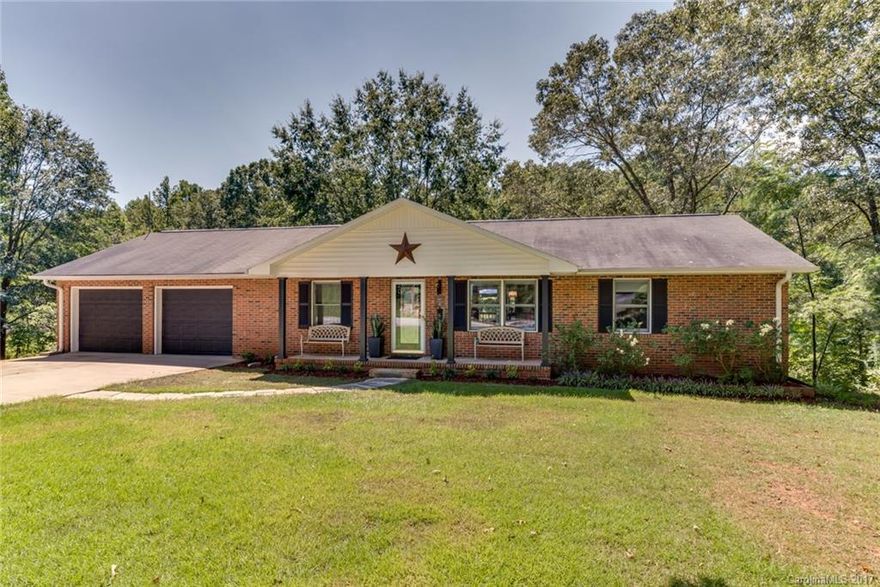 Beautiful Brick home in Landrum completely renovated.  Excellent investment property! Home features 2 separate living quarters with granite counters, all new appliances, new flooring thru-out home w/ luxury vinyl, tile & carpet.  2 new decks & 50 amp RV hook-up and pad  Double garage w/large storage/workshop. 10'ceilings downstairs as well as a garage.  Home is sold completely Furnished. Great income opportunity!