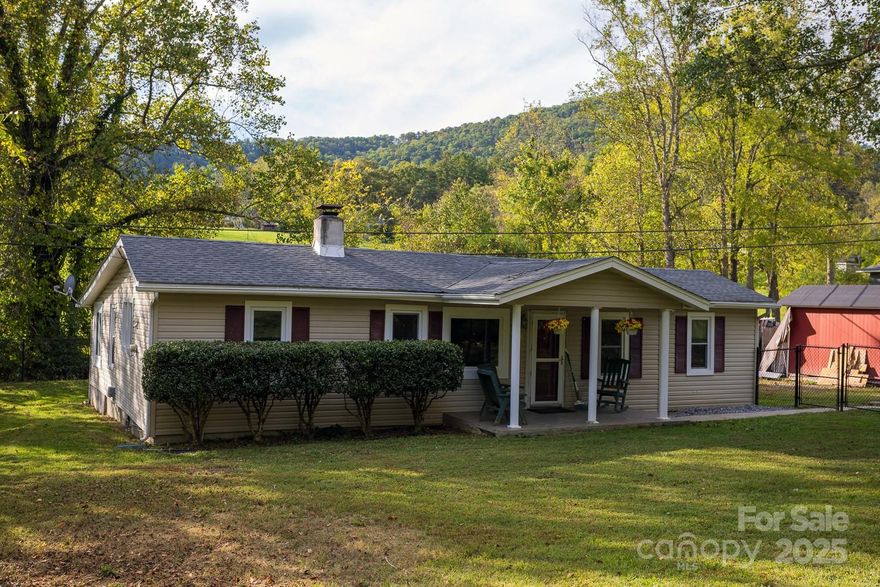 Here's a great opportunity to experience peaceful living just minutes from downtown Asheville at 948 Riceville Road. This charming 2-bedroom, 1-bath home sits on a half-acre lot of flat, useful land bordered by a small creek in the back and surrounded by gentle mountain views. Inside, you’ll find a bright, welcoming open layout with an additional flex room perfect for a home office, studio, or guest space. The fenced property offers plenty of room for pets, gardening, and outdoor living, all while maintaining a sense of quiet privacy. Whether you’re seeking your first home, a cozy retreat, or an investment opportunity, this one blends country tranquility with convenient access to Asheville’s amenities and great proximity to the VA hospital as well.