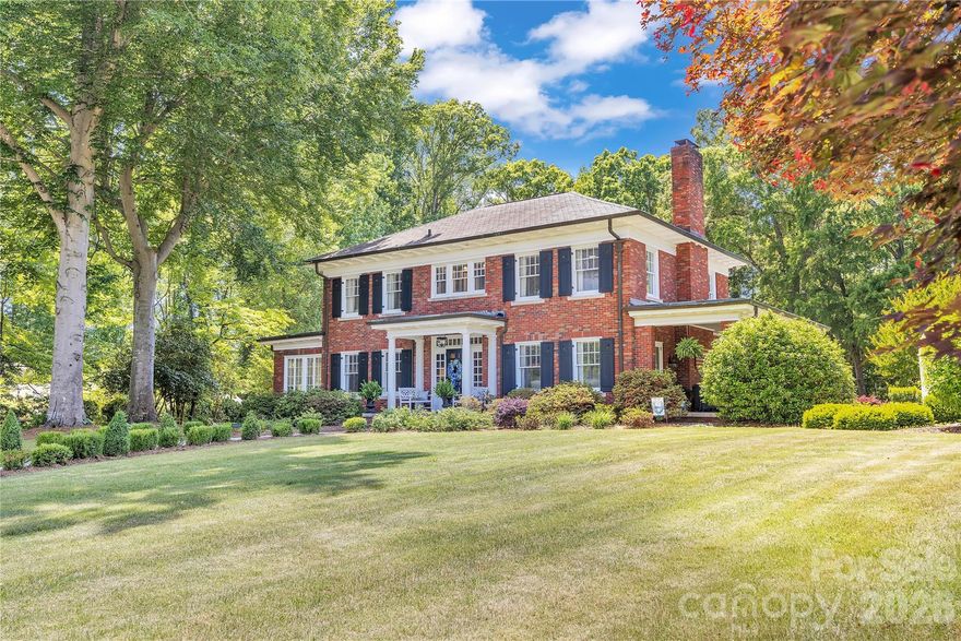Prepare to fall in love from the moment you step through the front door of this truly extraordinary home located in one of Historic Salisbury’s most treasured neighborhoods. Rich architectural details, exceptional craftsmanship, and beautifully updated living spaces combine to create a residence that feels both timeless and luxurious.

The breathtaking foyer immediately sets the tone with elegant frieze molding, gleaming hardwoods, and stunning beveled glass pocket doors that open into the gracious living room. This remarkable space features a handsome fireplace, custom accent wall, incredible built-in cabinetry, and two sets of beveled glass French doors opening to the expansive covered side porch. Natural light pours throughout the home, enhancing the warmth and sophistication found in every room.

Designed for both elegant entertaining and comfortable daily living, the dining room is beautifully scaled and opens into a charming sun porch complete with built-ins and a window seat — the perfect spot for morning coffee, reading, or quiet conversation.

The kitchen is simply exceptional. Thoughtfully renovated while respecting the character of the home, it offers a Viking 6-burner range with griddle, dual dishwashers, GE Monogram refrigerator, oversized island with storage, abundant cabinetry, and designer finishes throughout. The adjoining bar area includes beverage refrigerator, ice maker, sink, and additional storage, creating a seamless entertaining experience. A cozy keeping room beside the kitchen invites family and guests to gather while meals are prepared.

The music room is both elegant and inviting, opening directly onto the incredible covered side porch that feels like an outdoor living room. Beyond lies one of the property’s most magical features — the professionally designed side garden with white archway, mature landscaping, stone pathways, firepit, and multiple seating areas that create an atmosphere rarely found.

Ascending the stately staircase, the architectural half landing provides space for artwork, seating, or a reading nook. The primary suite is a true retreat featuring separate his-and-hers closets, including an extraordinary dressing-room-style closet that feels like its own private boutique space. The newly renovated primary bath is stunning with dual vanities, spacious walk-in shower with seat, beautiful tilework, and additional storage.

Bedrooms two and three are generously sized with a Jack-and-Jill bath, while bedroom four includes its own ensuite half bath. Exceptional built-ins and storage solutions are found throughout the home.

The professionally engineered waterproofed basement offers tremendous flexibility with workout space, hobby or craft areas, and abundant storage. Above the detached two-car garage, a finished heated and cooled bonus space creates wonderful options for office, studio, recreation, or guest overflow. A rear porch and half-court basketball area further enhance the property’s lifestyle appeal.

The grounds are absolutely spectacular — expansive, private, and meticulously maintained with mature landscaping and irrigation. Additional features include invisible fencing, generator, security system, and countless thoughtful details that make this home one of Historic Salisbury’s truly special offerings.