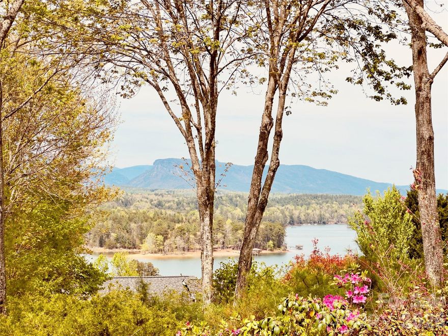 Tucked within a desirable lake community, this thoughtfully designed home offers breathtaking long-range views of three mountain ranges, including Short Off Mountain, along with coveted view of Lake James. With an additional adjoining 0.71-acre lot included, there’s added privacy and the opportunity to further enhance the already stunning scenery—just a bit of selective tree topping could open up even more of the view.

Inside, the home was carefully planned by its original owner, featuring a layout that maximizes both comfort and the surrounding natural beauty. Enjoy mountain and lake views from the back deck, living room, dining, kitchen open concept, creating a seamless connection between indoor and outdoor living. Additional features include 9 foot ceilings and tray ceilings, kitchen island with granite countertops and propane gas cooktop, crown molding, upstairs office, and bay windows for maximum natural light.  An additional feature is the gas logs fireplace in the living room for added warmth and efficiency.

The home features a partially finished basement complete with storage, a bedroom and full bath—ideal for guests. A bonus/flex/rec room that could easily be heated with a mini split or gas wall heater.  It offers interior and exterior access.

A valuable bonus is the included access to 2 boat slips, offering convenient access to Lake James for boating and water recreation. 

Practical features include a transferable termite plan and a spacious 2-car garage with golf cart access, perfect for the nearby course. Conveniently located directly across from the Marion Lake Club golf course and just minutes to Lake James State Park, you’ll enjoy easy access to hiking, kayaking, and lakeside picnics.

Whether you’re seeking a peaceful vacation retreat or a full-time residence or an investment Air BNB this property offers the perfect blend of views, location, and lifestyle.