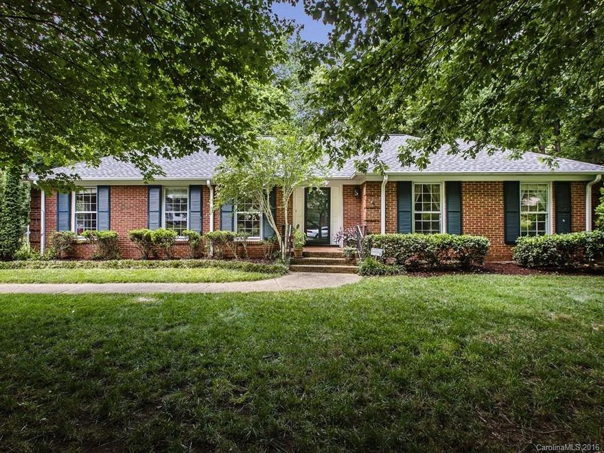 Spacious brick ranch in up & coming "MoRA" area is a must see! New HVAC just installed, roof in 2011, new laminate flooring, updated mstr bath, kitchen has stainless appliances, washer/dryer/refrigerator to remain. Has large eat in kitchen, separate dining rm, living rm & inviting den w/fireplace.  Enjoy the large, private fenced back yard for entertaining.  Conveniently located within minutes to uptown, schools, restaurants, as well as all renovations in the area. 1 year home warranty included.