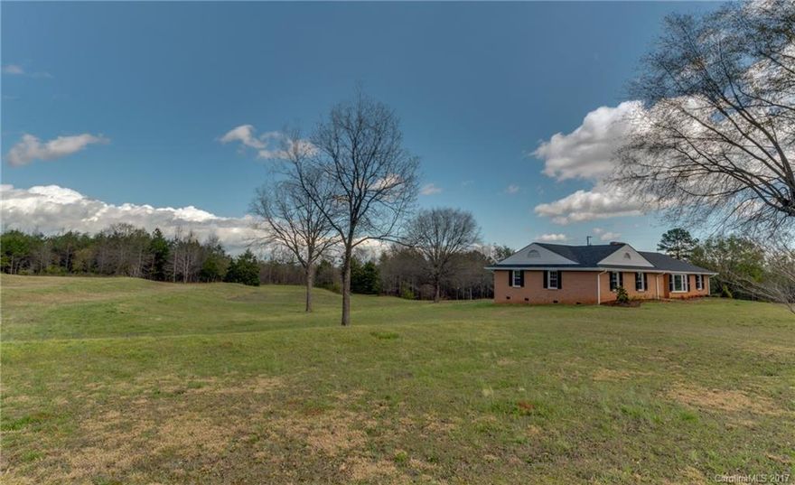 Rare find! This one story ranch features large rooms and lots of updates including brand new roof, windows, vinyl on the outside and heat pump. Interior upgrades include new vinyl in the bathrooms, new carpet and hardwood floors have been refinished. However the best part is 5 very usable acres mostly in grass with a great garden spot and fruit trees. Lastly, a 30x50 insulated outbuilding with concrete floor, heat, air and water! If country living is your passion do not let this gem pass you by!