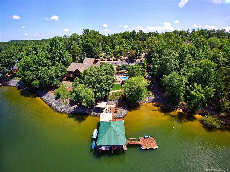 Watch the amazing sunsets from this rare western facing home. Every detail was considered with this distinctive home when it was taken down to the studs.  Ex. are shown in the kitchen with 2 microwaves/dishwashers, double ovens, Thermadore ref.lake views from all bedrooms, Mstr Bath with heated floors, his/hers closets and attached laundry, approx. 230' of shoreline, 2 boat&wave runner lifts, floating dock, deep water, saltwater pool/hot tub. Beautifully landscaped yard with lighting/irrigation.