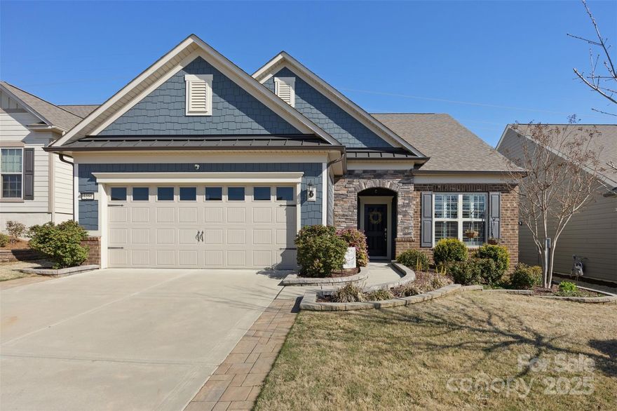 One of the best values in the community and with so much to offer! The gorgeous Martin Ray flrplan features  Gracier Gray colored cabinets with a huge island, raised DW, Butlers pantry, walk in pantry, coffee bar, beautiful stone tile bcksplsh, range hood, open plan to the great rm and DR, with elegant crown moldings, a stone gas fireplace, a bright sunroom overlooks the backyard and greenspace, the front rm can be an office, wine rm or reading, the primary BR feature wonderful natural light, a spacious layout, a walk in customized closet, oversized shower with tile surround, dual vanities and tile flooring. Upstairs enjoy a loft and a huge walk in storage attic. Don't miss the plantation shutters, a beautiful secondary BR and Bath, a drop zone, a 3 car tandem garage with epoxy finished floors, a relaxing covered patio off of the sunroom with a remote controlled shade, upgraded landscaping with stone edging and the amazing resort style amenities, pool, tennis, fitness, clubs and more!