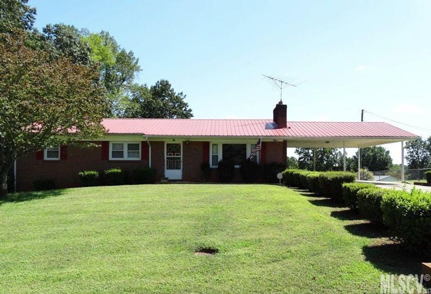 Nice brick ranch with full basement in desirable location in Granite Falls! Living Room with beautiful refinished hardwood floors, brick fireplace & wood accent wall. LR is open to the Dining Area with storage closet. Kitchen with gas cooktop, wall oven & refrigerator offers access to the 24’ x 24’ double carport and unfinished basement. MBR offers a private MBA w/new tile shower. Two additional BRs plus a large hall bathroom. Basement offers laundry area, single garage area, wood stove and plenty of workshop space. Large .89 Acre lot offers spacious back yard. Replacement windows, security system.