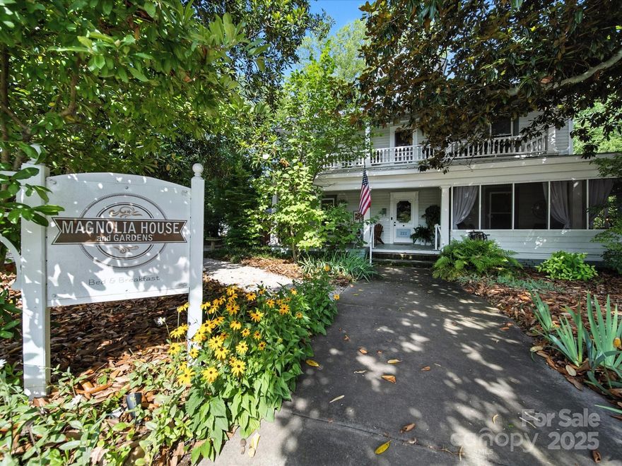 Magnolia House & Gardens – A Turnkey Commercial Opportunity

Step into a rare opportunity with the renowned Magnolia House & Gardens, a thriving and income-producing property currently operated as a 5-star rated bed & breakfast. With an established reputation for excellence, this enchanting property has not only welcomed countless overnight guests but also served as the perfect backdrop for weddings, private parties, and special events.  Fully operational, turnkey business with stellar reviews, Event-ready venue that has hosted weddings & gatherings. 1.71 acres at the rear offering unlimited expansion potential – additional parking, pool, new facilities, or extended event space. Endless possibilities to reimagine and scale the property. Perfectly situated between Charlotte and Lake Wylie, Magnolia House & Gardens provides both convenience and charm drawing guests regionally and beyond. Whether you envision continuing its legacy as a hospitality business or reimagining it for another use, this is the canvas you’ve been waiting for. The possibilities are as endless as your vision.  Most furniture, décor, and operating items will convey with the sale (with the exception of select personal items belonging to the owner)