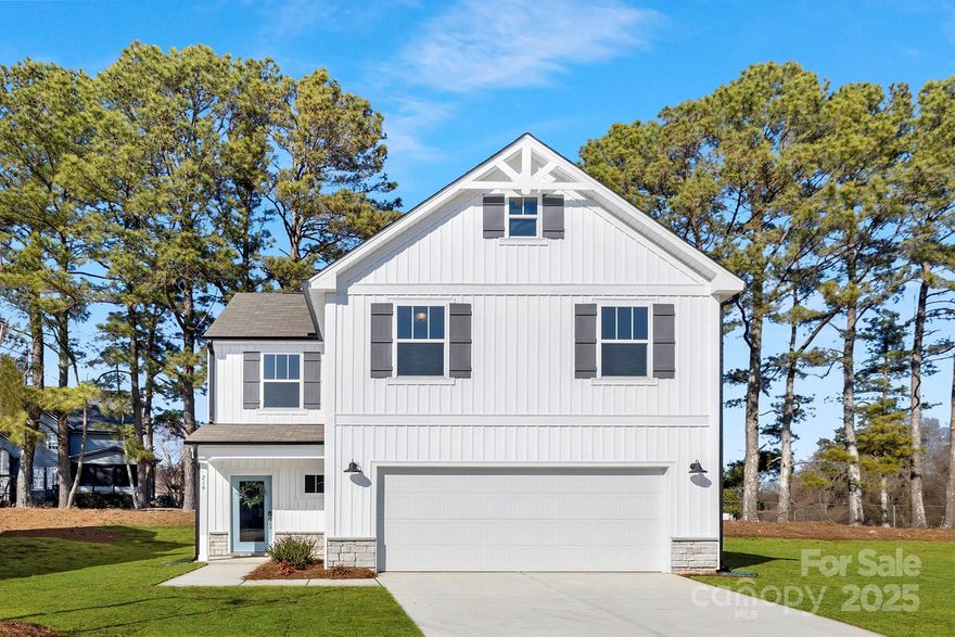 Quick Move-In Ready Now! The semi-custom Aria plan offers 3 bedrooms, 2.5 baths, and 1,723 square feet of open living space with modern finishes throughout. The large great room flows seamlessly into the dining area and kitchen, creating a perfect space for relaxation and entertaining. Upstairs, a versatile loft area leads to the spacious primary bedroom with an ensuite, two additional bedrooms, a full bath, and a convenient laundry room. Located at Eagle’s Crest, just 50 minutes from Charlotte, NC, and 28 minutes from Monroe, NC, this community provides the ideal mix of small-town charm and easy access to shopping, dining, and entertainment, making it a prime location for today’s lifestyle.