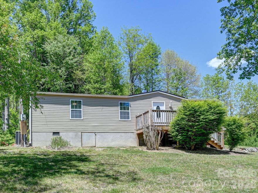 This well maintained property boasts the following: recently and completely remodeled, nearly new appliances including washer/dryer, sits on almost an unrestricted half acre, level yard with mature flowering bushes, outdoor shed with electricity, covered back porch with a concrete patio, and a small creek on the property.  
This lovely home has seen little use, and is in great condition.  Under 15 minutes to I-26 and shopping, with easy access off  64 East, Sugarloaf Road, or Upward Road.  Don't miss the opportunity to own your own .47 unrestricted acres and well kept home in Henderson County for under $300K.