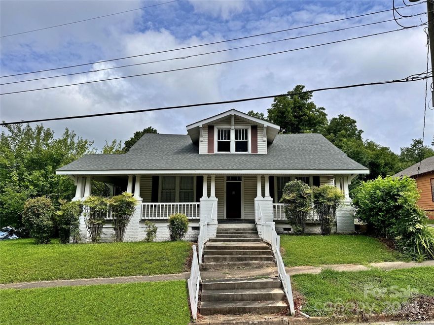 Discover the potential of this historical home in Lancaster, built in 1925. While it boasts a spacious 2,000 sq ft main level that is heated & cooled, the home requires significant repairs. The 890 sq ft upstairs, remains largely untouched since its original construction & lacks modern heating & cooling. It features 3 bedrooms & 1 full bath, but none of the bedrooms have closets & the space shows its age & need for renovation. There is also a 692 sq ft secondary living quarters with a bedroom & bathroom, accessible only from the exterior. This space was once part of the main house but has since been divided off. The property also includes a 0.45-acre lot across the street, currently used as a parking lot. Previously utilized as a Sorority meeting house, this home is a true fixer-upper, offering a blank canvas for restoration & customization. Ideal for those ready to take on a project, this property has the potential to be transformed into a charming residence or investment opportunity.