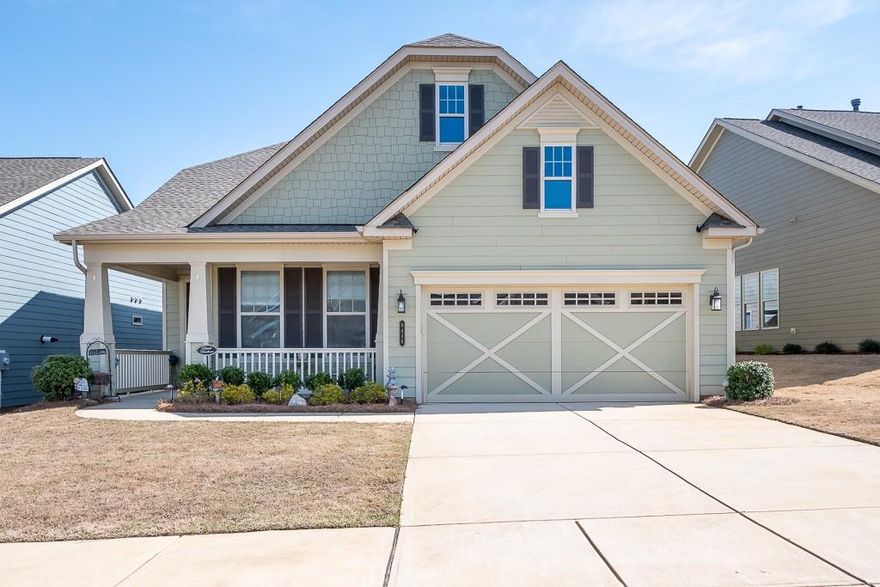 This “better than new”, award-winning DOGWOOD plan features kitchen in the rear of the home w/center island, granite counters, undermount lighting, SS appliances & tile backsplash. Ceiling fans, custom window treatments, low maintenance LVP flooring throughout. Dining area flows into the Living Room with 11' ceiling. Great natural light and direct access to the covered rear porch w/fenced yard and extended patio where you can relax with your favorite beverage and enjoy PRIVACY! The Owner’s Suite is complete with upgraded Luxury "Spa" bath with walk-in tiled shower, grab bar, dual separate vanities and walk-in closet! 2-car Garage w/ 4' extension has light attic STORAGE above. Irrigation is on community well! HOA includes lawn maintenance, irrigation system, internet, cable and security. Amenities include outdoor pool, indoor lap pool, tennis courts, pickleball courts, hot tub, pool table, walking trails, fitness center & MORE. Have your dream home NOW - without having to wait to build!