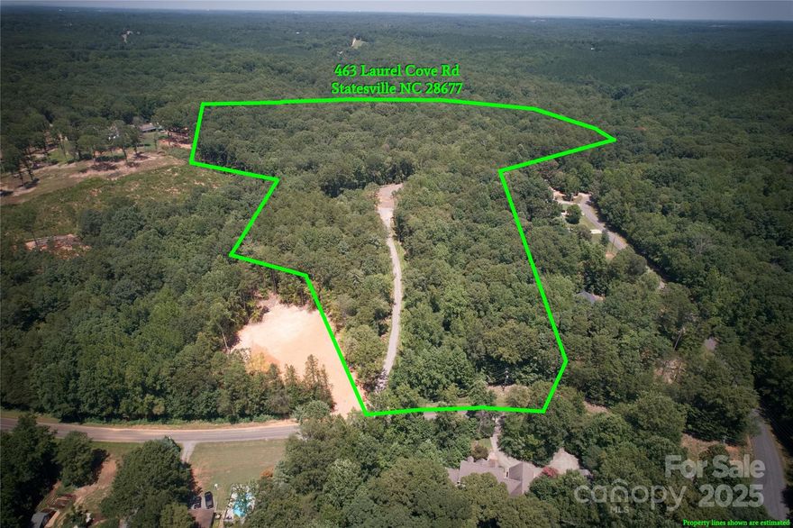 14.89 acres of private land located directly across from Lake Norman and just minutes from Lake Norman State Park, with community lake access. Access the property via a 500-foot gravel driveway leading to a cleared, level homesite ready for construction. Bring your own builder or consult with ours. Septic permit approved for a 4-bedroom home. Building requirements are as follows: single-story homes minimum 2,000 sq ft; 1.5-story homes minimum 2,200 sq ft; two-story homes minimum 2,400 sq ft. Enjoy 360-degree panoramic views and endless potential. A rare opportunity to build your dream home in a peaceful, scenic setting.