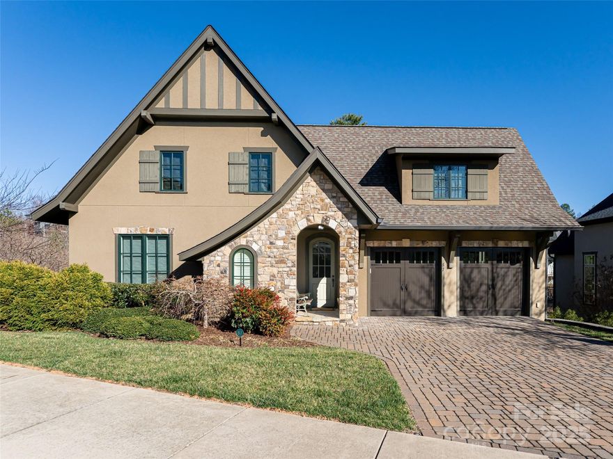 This like-new custom-built residence in the gated Villages of Thoms Estate offers a perfect lock-and-leave lifestyle with timeless architecture and high-end finishes. An arched vintage brick entry welcomes you into an open floor plan where engineered Hickory floors extend through the main living and dining areas. The light-filled gourmet kitchen features a built-in microwave drawer, decorative bronze tile backsplash, and Cambria quartzite countertops, which also enhance the lower-level bar. The sunroom boasts Scabos travertine flooring in a French pattern, while the lower deck features durable trex wood flooring. A main level patio includes a built-in Lynx gas grill with a granite countertop, perfect for outdoor gatherings. Custom Hunter Douglas window treatments add elegance throughout. Handcrafted hammered nickel sinks elevate the half bath and bar, and a Hi-Tech monitored security system provides peace of mind. Community amenities include walking trails, a pavilion, gardens.