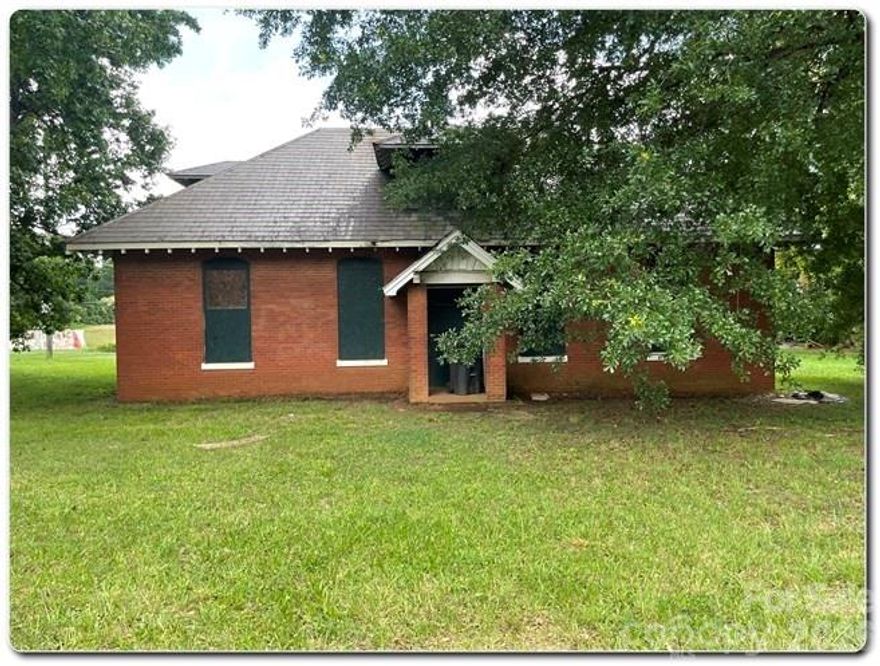 Incredible Opportunity to Own a Piece of Charlotte History! This charming 2-story brick building was once the original General Store for the Hoskins Mill community in the early 1900s. Bursting with historical character, it features an original slate roof, hand-etched safe, window moldings, exposed brick walls, and a stunning atrium—all perfect for incorporating into your renovation plans. The current development plan includes two 2-bedroom/2-bath units upstairs and four 1-bedroom/1-bath units with a shared common area downstairs. Located just minutes from Uptown Charlotte, this property offers rich history, architectural charm, and excellent potential for residential income or creative redevelopment. No Utilities are present and City Water/Sewer connections are needed, but not present.
