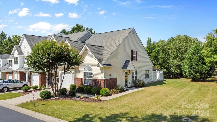 Back on the market through no fault of seller! Discover this Hanover neighborhood gem with PRIMARY bedroom and en-suite bath ON MAIN! The 2 story, 2-bedroom, 2.5-bath END UNIT townhome is nestled in the coveted Indian Land Schools! Step inside to the bright, open living area, spacious eat-in kitchen with convection oven, ss refrigerator and laundry area where washer/dryer convey. Living area has vaulted ceilings making the home feel larger than its 1604 sq ft. The second floor boasts an open loft/flex space overlooking the first floor and a generously sized bedroom with separate full bath. Outside, you'll fall in love with the partially fenced covered patio. This versatile space can be enclosed to create an additional outdoor living area. There is the convenience of a 1-car attached garage and driveway. But that's not all – the incredible HOA neighborhood amenities include: lawn maintenance, in-ground pool, playground, sidewalks and picnic area. NO RENTAL CAP!