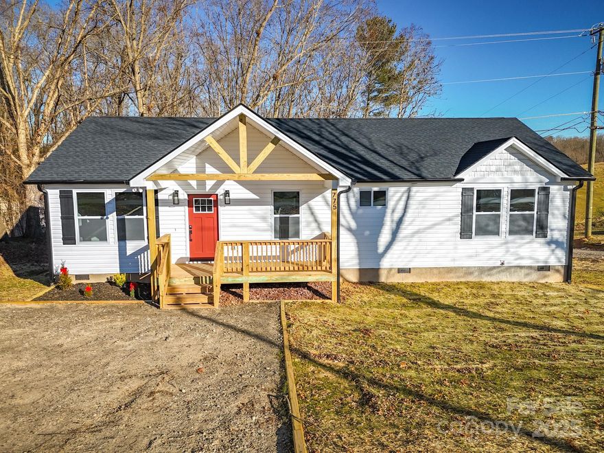 Experience the ultimate mountain lifestyle in this stunning brand-new construction home! This location offers unparalleled access to outdoor recreation, where you can explore the serene riverfront trails along the French Broad River or enjoy a relaxing afternoon at Woodfin Riverside Park. Savor a craft brew at the nearby Salt Face Mule Brewing Co. or Zillicoah Beer Company, and look forward to the excitement of the upcoming Woodfin Whitewater Wave and expanded greenway systems. Inside, the open floor plan is bathed in warm natural light, creating an inviting atmosphere perfect for entertaining guests. The kitchen is a chef’s delight, featuring stainless steel appliances, granite countertops, and sleek soft-close cabinets. Luxury vinyl plank flooring flows seamlessly throughout the home, leading to a roomy primary suite complete with a large walk-in closet and an elegant bath featuring a dual vanity and a custom tile shower. Step outside to the spacious deck to breathe in the crisp mountain air and take in the serene surroundings. This home is perfectly poised to be the backdrop for your cherished memories or to serve as a high-end investment property. Discover the perfect blend of modern luxury and natural beauty in this exceptional new home! Potentially up to $2,500 in closing credit.*